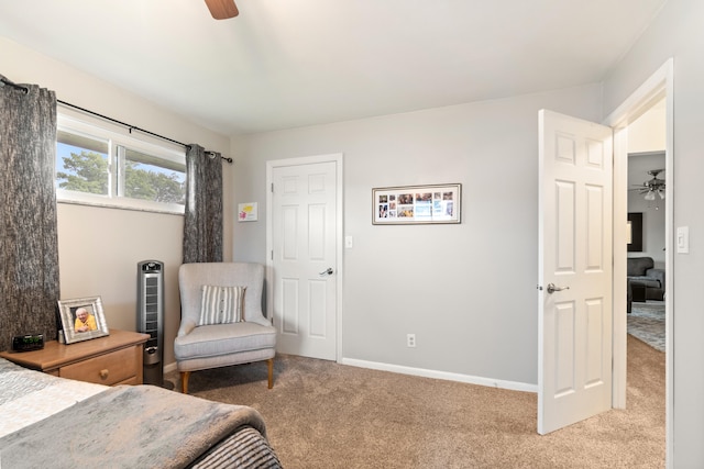 1403 Joseph St, Jackson, MI 49202 - bedroom featuring light carpet, baseboards, and a ceiling fan