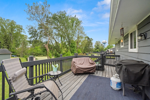 1403 Joseph St, Jackson, MI 49202 - wooden terrace with view of wooded area