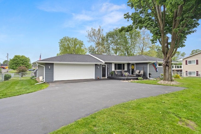 1403 Joseph St, Jackson, MI 49202 - ranch-style house with an attached garage and asphalt driveway