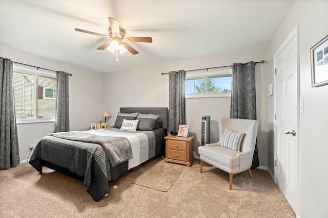 1403 Joseph St, Jackson, MI 49202 - bedroom with light carpet, a ceiling fan, and baseboards