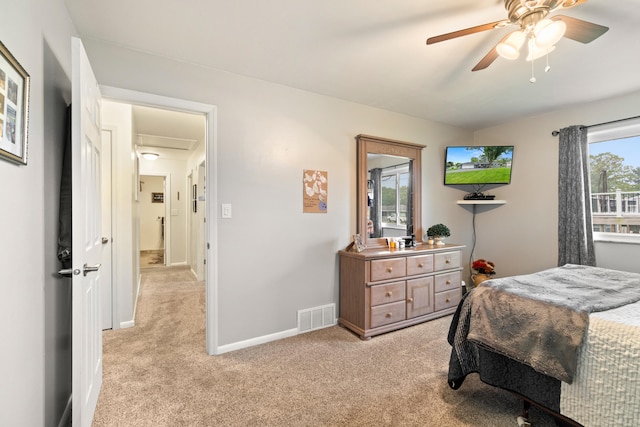 1403 Joseph St, Jackson, MI 49202 - bedroom with light colored carpet, baseboards, and ceiling fan