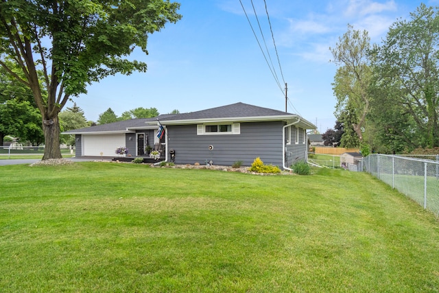 1403 Joseph St, Jackson, MI 49202 - rear view of property with an attached garage