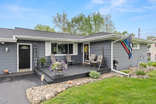 1403 Joseph St, Jackson, MI 49202 - view of front of house featuring a front yard and a deck