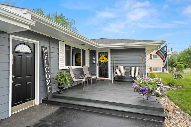 1403 Joseph St, Jackson, MI 49202 - deck with a lawn and a garage