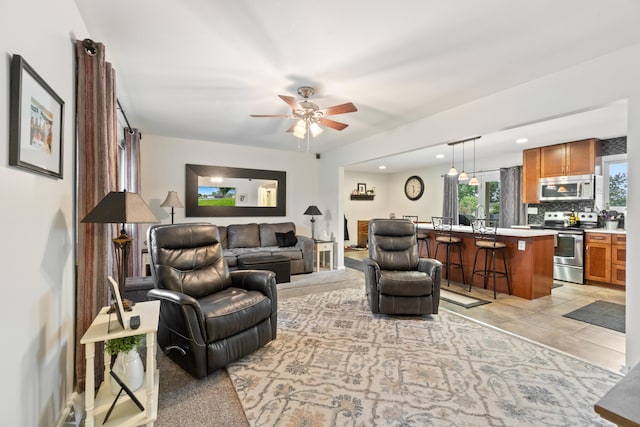 1403 Joseph St, Jackson, MI 49202 - living area featuring a ceiling fan and recessed lighting