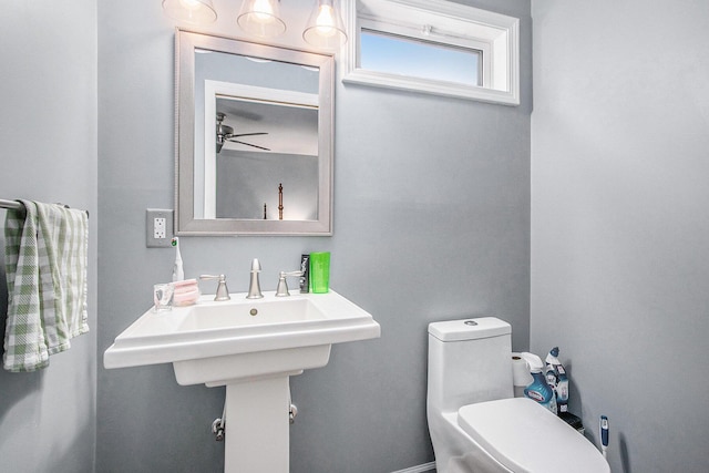 10933 Portage Rd, Portage, MI 49002 - half bath with a ceiling fan and toilet