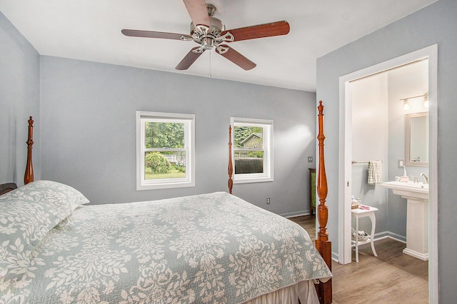 10933 Portage Rd, Portage, MI 49002 - bedroom featuring wood finished floors, baseboards, and a ceiling fan