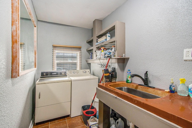 10933 Portage Rd, Portage, MI 49002 - laundry room featuring a textured wall, washing machine and clothes dryer, and tile patterned flooring