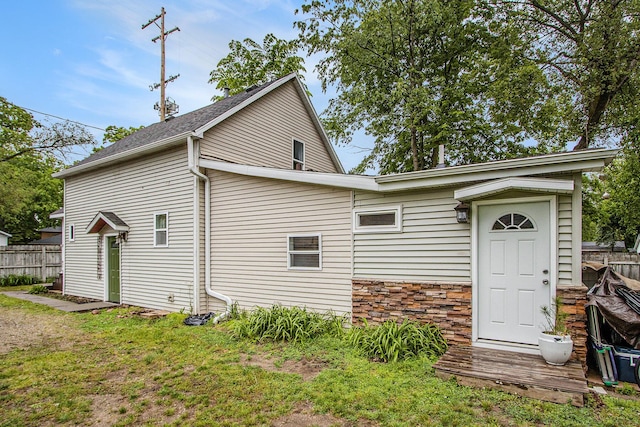 10933 Portage Rd, Portage, MI 49002 - rear view of property featuring stone siding