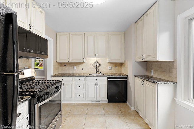 2193 Earlmont Rd, Berkley, MI 48072 - kitchen featuring black appliances, decorative backsplash, dark stone countertops, and light tile patterned floors