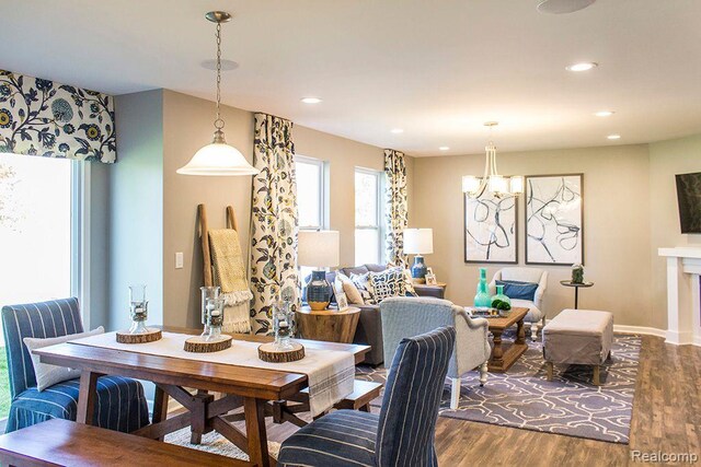 58182 Pembrooke Ave, New Haven, MI 48048 - dining room featuring dark wood-type flooring, recessed lighting, a chandelier, and baseboards