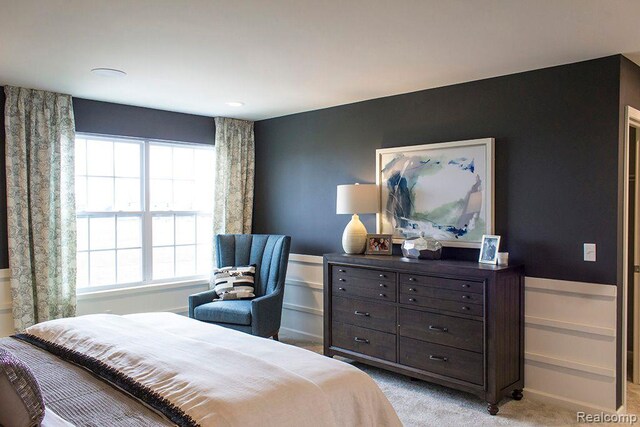 58182 Pembrooke Ave, New Haven, MI 48048 - bedroom featuring light carpet and a wainscoted wall