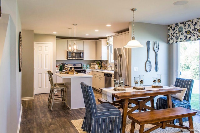 58182 Pembrooke Ave, New Haven, MI 48048 - dining space featuring dark wood finished floors, recessed lighting, baseboards, and a chandelier