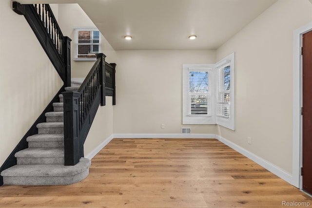 1502 Harding St, Detroit, MI 48214 - foyer entrance featuring stairway, wood finished floors, baseboards, and recessed lighting