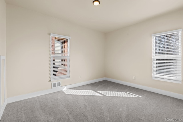 1502 Harding St, Detroit, MI 48214 - carpeted empty room featuring baseboards