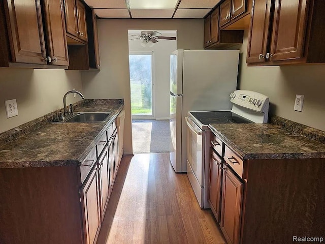 953 Kirts Blvd, Troy, MI 48084 - kitchen featuring white range with electric cooktop, a sink, light wood-style floors, dark countertops, and a ceiling fan
