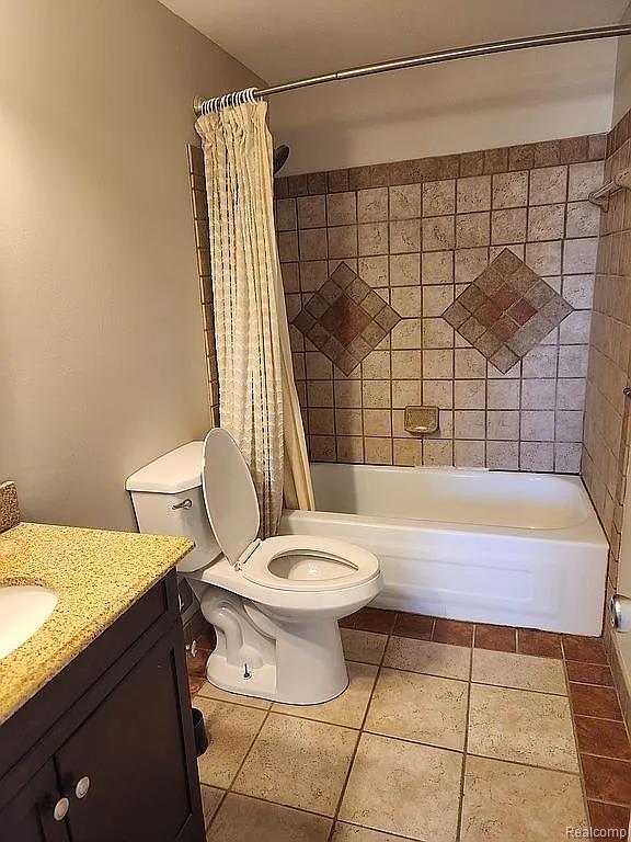 953 Kirts Blvd, Troy, MI 48084 - bathroom with vanity, tile patterned flooring, shower / bath combo, and toilet