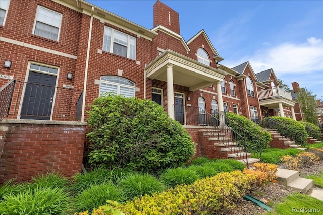 3070 Camden Dr, Troy, MI 48084 - view of front of house with brick siding and a chimney