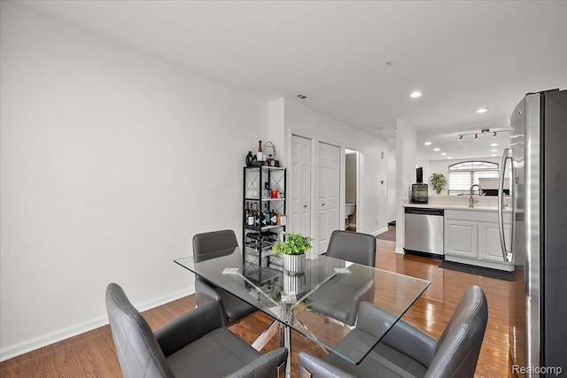 3070 Camden Dr, Troy, MI 48084 - dining area featuring dark wood finished floors, baseboards, and recessed lighting