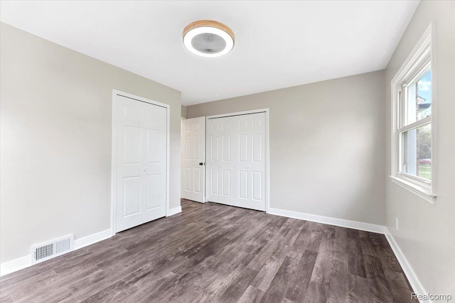 16355 Windermere Cir, Romulus, MI 48195 - unfurnished bedroom featuring wood finished floors, baseboards, and a closet