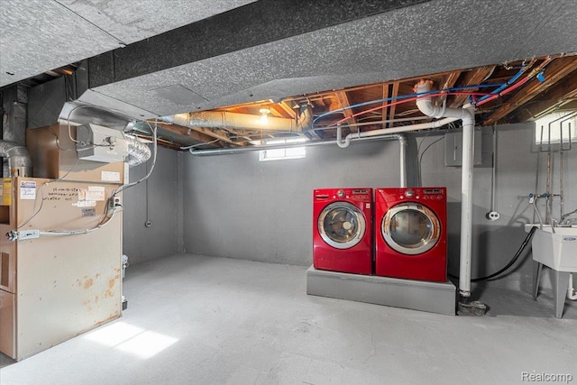 16355 Windermere Cir, Romulus, MI 48195 - basement with washer and dryer, heating unit, and a sink