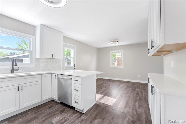 16355 Windermere Cir, Romulus, MI 48195 - kitchen featuring dishwasher, a sink, dark wood-type flooring, a peninsula, and light countertops