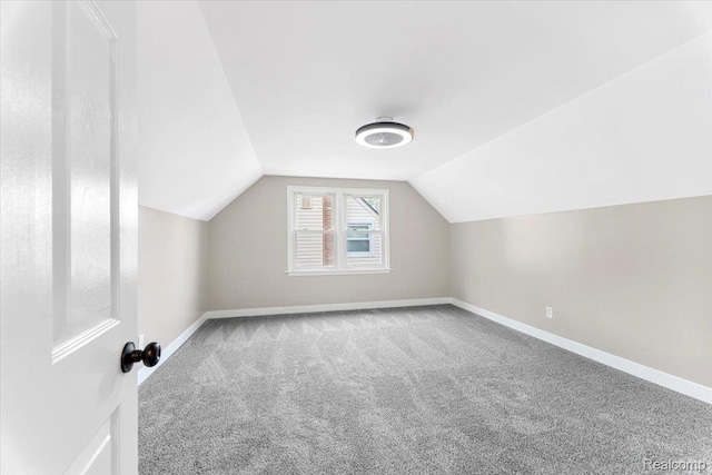 16355 Windermere Cir, Romulus, MI 48195 - additional living space with carpet floors, baseboards, and lofted ceiling