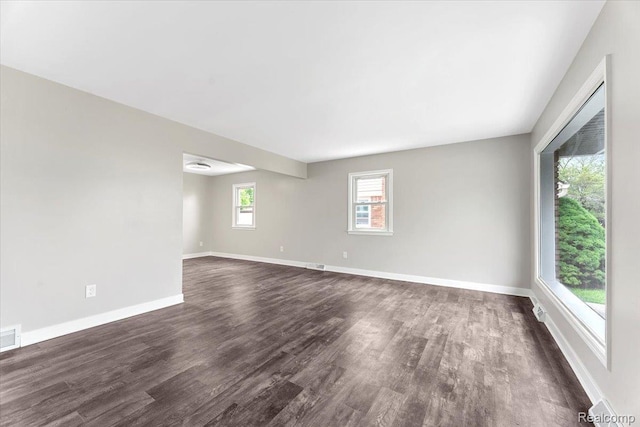 16355 Windermere Cir, Romulus, MI 48195 - empty room featuring dark wood-style flooring and baseboards