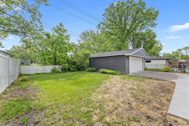 16355 Windermere Cir, Romulus, MI 48195 - view of yard featuring an outbuilding and a detached garage