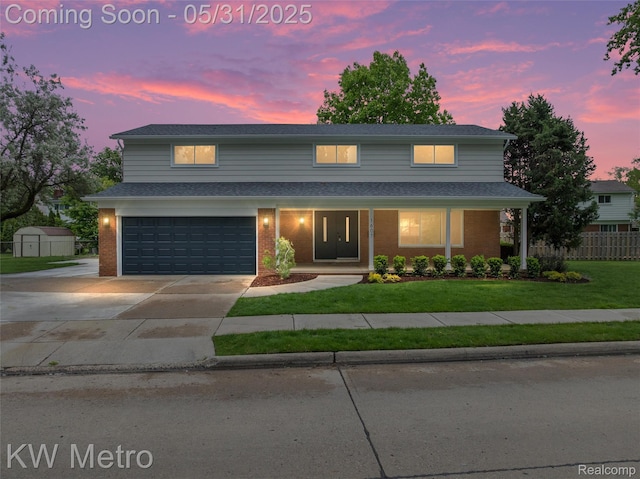 1607 Yorktown St, Grosse Pointe Farms, MI 48236 - traditional home with a garage, brick siding, driveway, a storage unit, and a porch