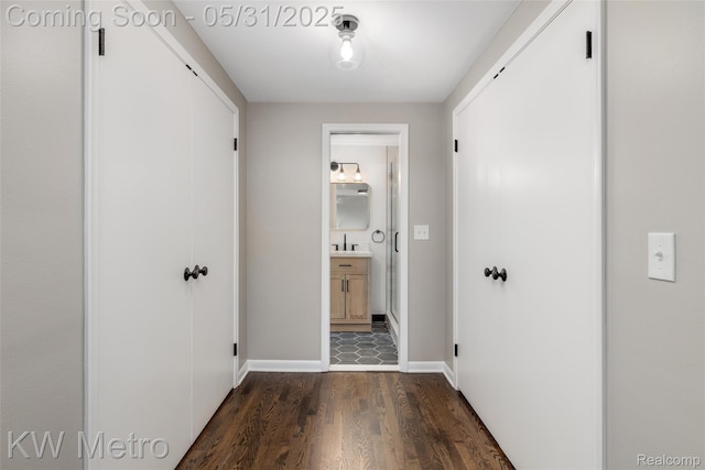 1607 Yorktown St, Grosse Pointe Farms, MI 48236 - hall with dark wood-style floors, baseboards, and a sink