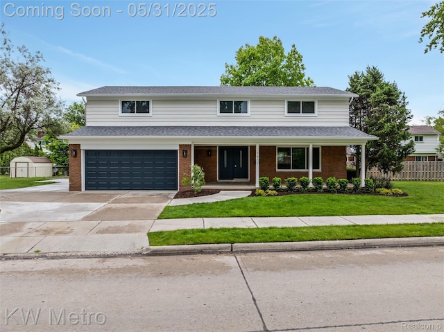 1607 Yorktown St, Grosse Pointe Farms, MI 48236 - traditional-style home with a garage, brick siding, and driveway
