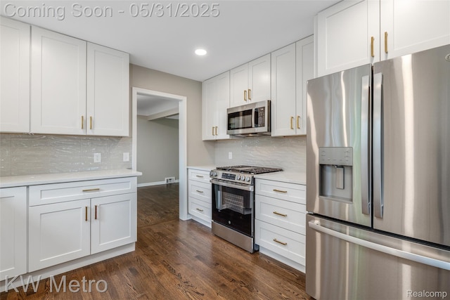 1607 Yorktown St, Grosse Pointe Farms, MI 48236 - kitchen with appliances with stainless steel finishes, light countertops, white cabinetry, recessed lighting, and dark wood-style floors