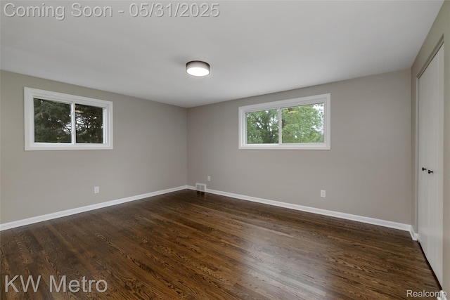 1607 Yorktown St, Grosse Pointe Farms, MI 48236 - empty room with baseboards and dark wood-style flooring