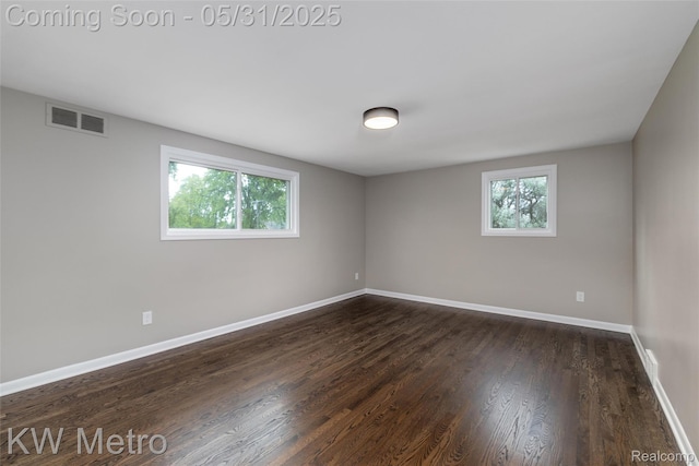 1607 Yorktown St, Grosse Pointe Farms, MI 48236 - empty room with dark wood-style flooring and baseboards