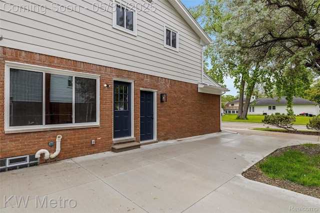 1607 Yorktown St, Grosse Pointe Farms, MI 48236 - view of exterior entry featuring brick siding