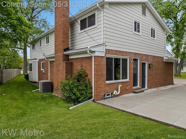 1607 Yorktown St, Grosse Pointe Farms, MI 48236 - back of property featuring a chimney, a patio, brick siding, central air condition unit, and entry steps