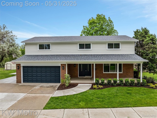 1607 Yorktown St, Grosse Pointe Farms, MI 48236 - traditional home featuring brick siding, covered porch, a front yard, driveway, and a garage