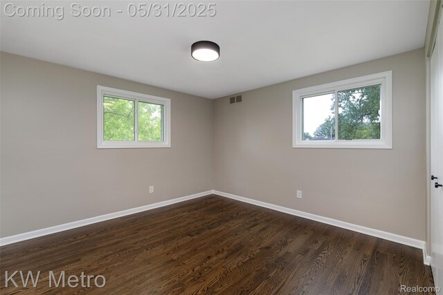 1607 Yorktown St, Grosse Pointe Farms, MI 48236 - empty room with baseboards and dark wood-type flooring