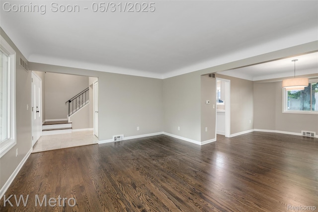 1607 Yorktown St, Grosse Pointe Farms, MI 48236 - spare room with stairway, wood finished floors, and baseboards