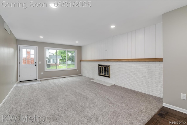 1607 Yorktown St, Grosse Pointe Farms, MI 48236 - unfurnished living room featuring baseboards, a brick fireplace, recessed lighting, and carpet floors
