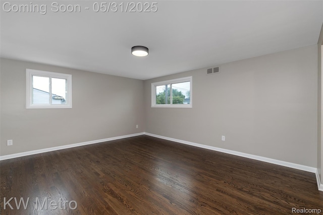 1607 Yorktown St, Grosse Pointe Farms, MI 48236 - spare room featuring baseboards and dark wood-style flooring