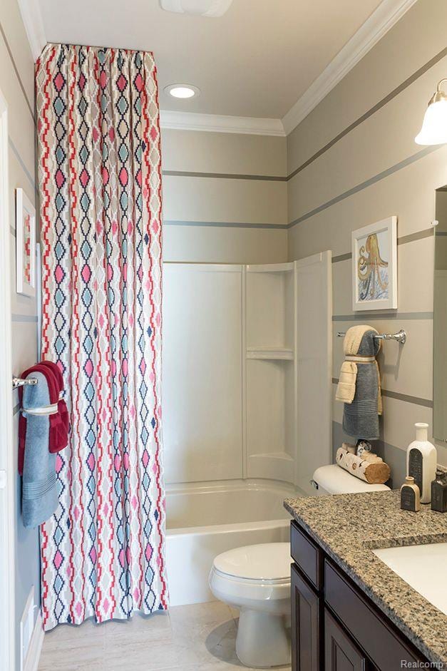 14268 Durant St, Fenton, MI 48451 - bathroom with vanity, ornamental molding, toilet, shower / bath combo with shower curtain, and recessed lighting