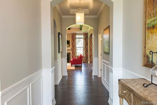 14268 Durant St, Fenton, MI 48451 - corridor with arched walkways, wainscoting, a decorative wall, dark wood-style floors, and crown molding