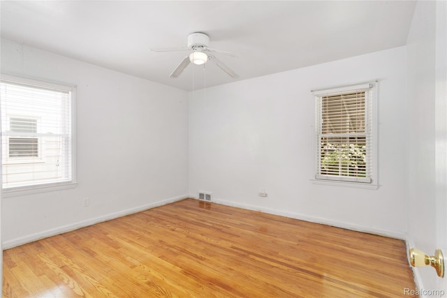630 Symes Ave, Royal Oak, MI 48067 - empty room with ceiling fan, healthy amount of natural light, light wood-style floors, and baseboards