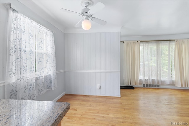 630 Symes Ave, Royal Oak, MI 48067 - unfurnished room with light wood-type flooring, a ceiling fan, and baseboards