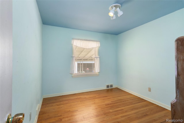 630 Symes Ave, Royal Oak, MI 48067 - empty room with wood finished floors and baseboards
