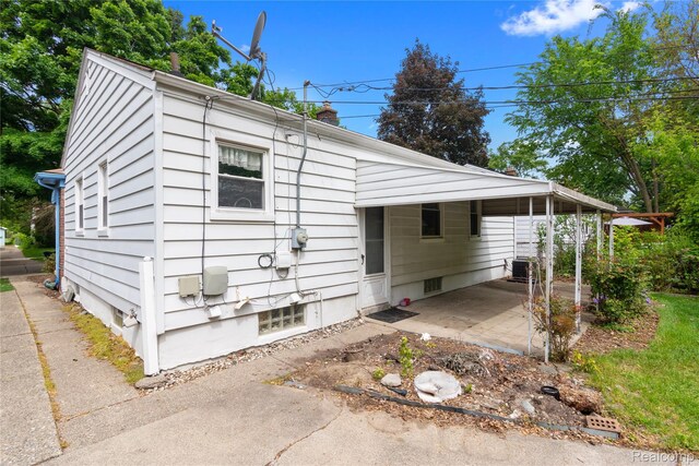 630 Symes Ave, Royal Oak, MI 48067 - view of front of home with a chimney and cooling unit