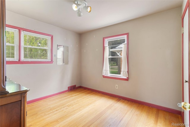 630 Symes Ave, Royal Oak, MI 48067 - empty room with light wood-style flooring and baseboards