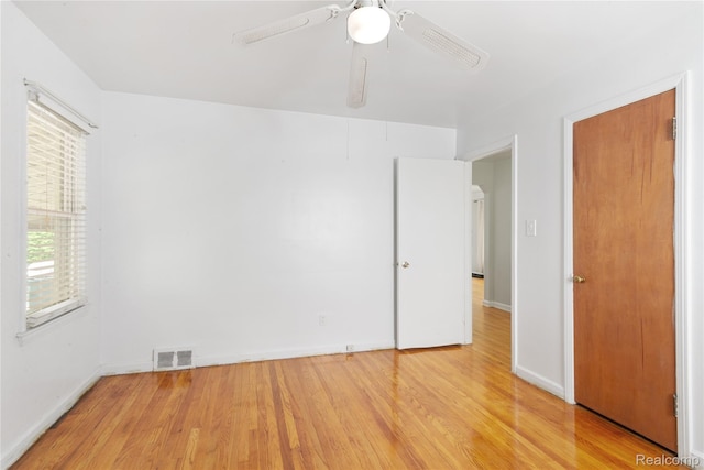 630 Symes Ave, Royal Oak, MI 48067 - unfurnished bedroom featuring light wood finished floors, baseboards, and ceiling fan